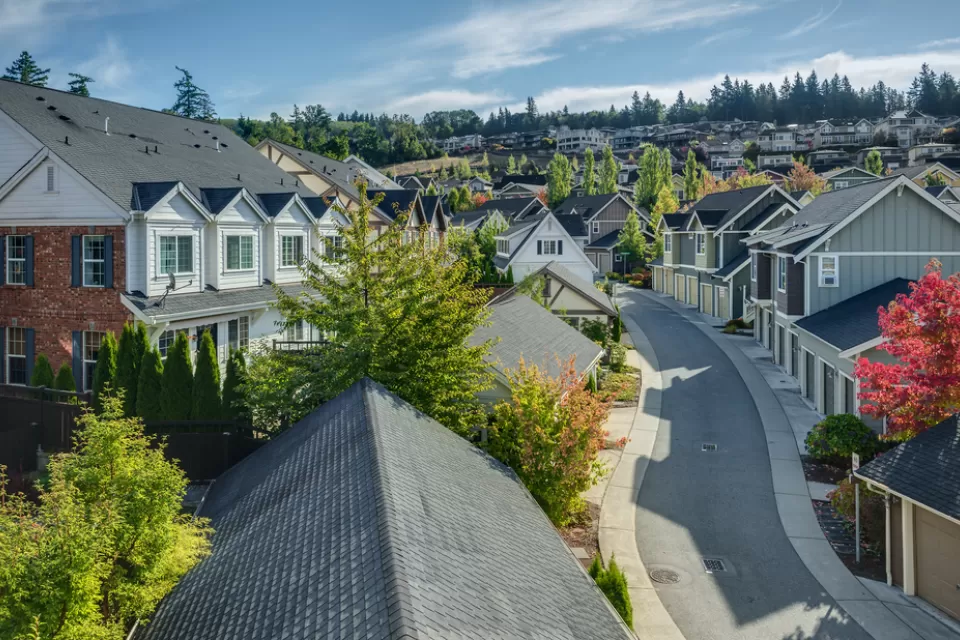 Curvy street lined with houses in Issaquah Highlands outside Seattle, Washington